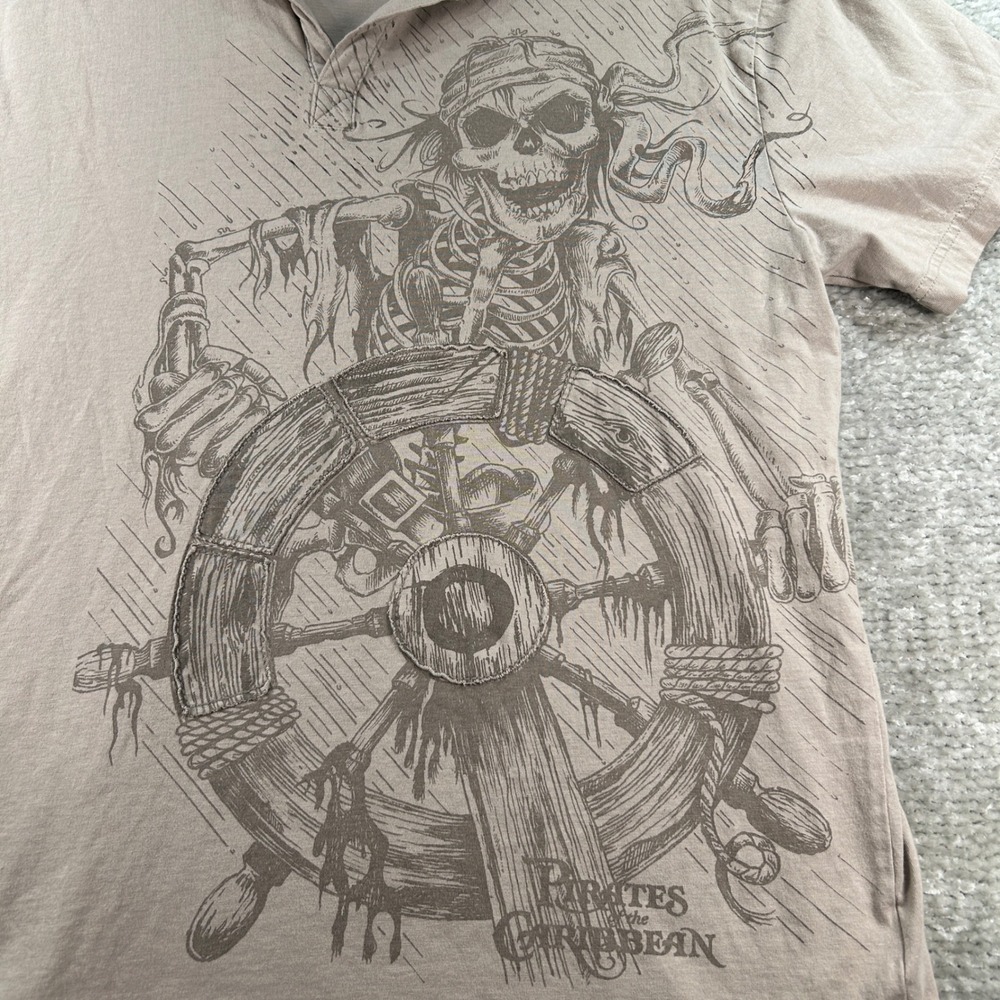 Disney Parks Pirates of the Caribbean Skeleton Graphic Polo Shirt Tan Mens L - Picture 2 of 8